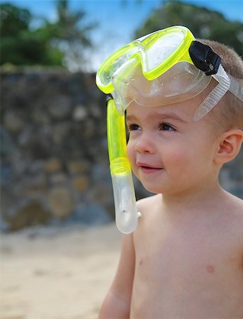 smile as mask for boy - Cute smiling little boy wearing snorkel set Stock Photo - Budget Royalty-Free & Subscription, Code: 400-07124413