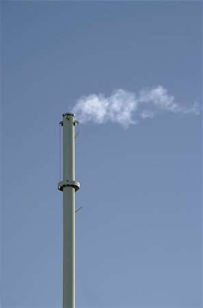 Smokestack in front of gray background. Vertical. Foto de stock - Royalty-Free Super Valor e Assinatura, Número: 400-07124512