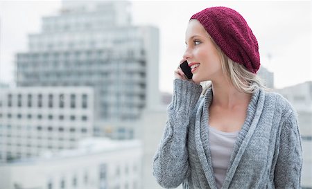 Happy pretty blonde on the phone outdoors on urban background Stock Photo - Budget Royalty-Free & Subscription, Code: 400-07126127