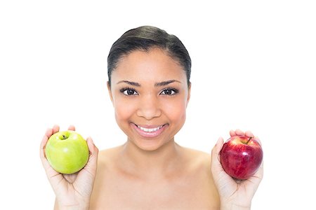 Happy young dark haired model holding apples on white background Photographie de stock - Aubaine LD & Abonnement, Code: 400-07127105