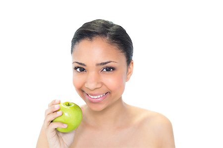 Beautiful young dark haired model holding a green apple on white background Photographie de stock - Aubaine LD & Abonnement, Code: 400-07127101