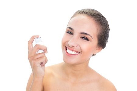 photo inhaler person - Smiling young brunette woman holding an inhaler on white background Stock Photo - Budget Royalty-Free & Subscription, Code: 400-07128027