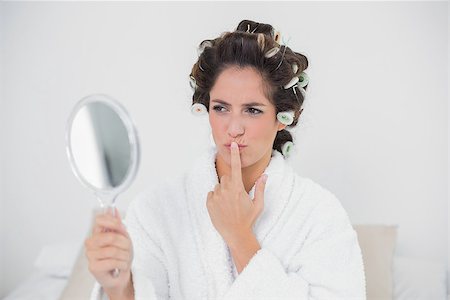 simsearch:649-02199405,k - Pensive natural brunette looking at mirror in bedroom Stockbilder - Microstock & Abonnement, Bildnummer: 400-07128813