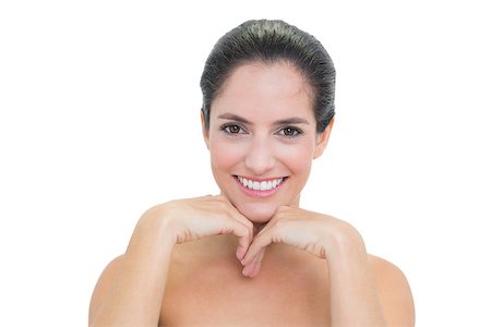 simsearch:614-03649482,k - Cheerful bare brunette touching her chin on white background Photographie de stock - Aubaine LD & Abonnement, Code: 400-07128897