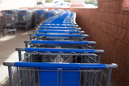 empty shopping cart - Many blue and gray shopping carts lined up and ready to go shopping. Photographie de stock - Aubaine LD & Abonnement, Code: 400-07122939