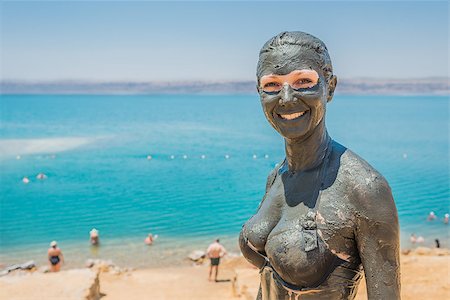 one caucasian woman applying dead sea mud body care treatment  in jordan Stock Photo - Budget Royalty-Free & Subscription, Code: 400-07123356