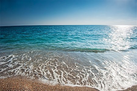 summer beach sea backgrounds - Splash of sea foam on a sandy beach Stock Photo - Budget Royalty-Free & Subscription, Code: 400-07123399
