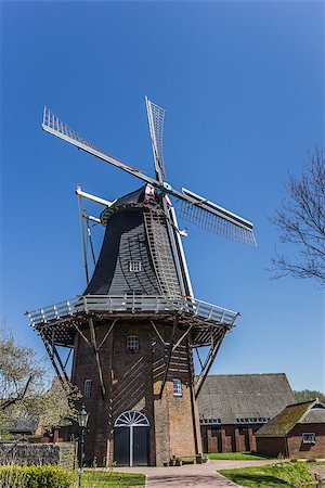 simsearch:400-08432432,k - Dutch windmill De Stormvogel in Loppersum, the Netherlands Fotografie stock - Microstock e Abbonamento, Codice: 400-07123750