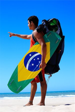 Kite surfer with the brazilian flag painted on the board with "praia e vento" (beach and wind) instead of "ordem e progresso"  in prainha beach near fortaleza Stock Photo - Budget Royalty-Free & Subscription, Code: 400-07123834