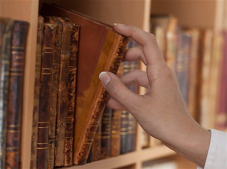 simsearch:400-08031960,k - woman hand holding old book library close up Stock Photo - Budget Royalty-Free & Subscription, Code: 400-07123886
