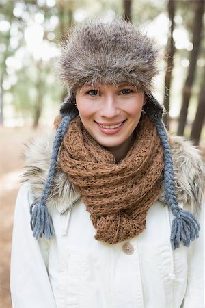 fur stole fashion - Portrait of a beautiful woman wearing fur hat with woolen scarf and jacket in the woods Stock Photo - Budget Royalty-Free & Subscription, Code: 400-07135634