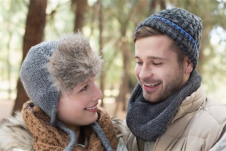 Close up of a young couple in winter clothing in the woods Stock Photo - Budget Royalty-Free & Subscription, Code: 400-07135651