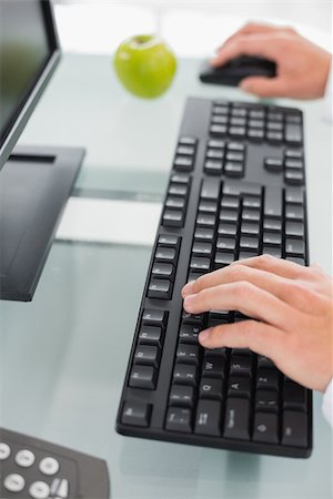 Close up of doctor's hands using computer at medical office Stock Photo - Budget Royalty-Free & Subscription, Code: 400-07137349