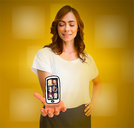 Cheerful woman levitating a mobile phone picture on yellow background Stock Photo - Budget Royalty-Free & Subscription, Code: 400-07137812