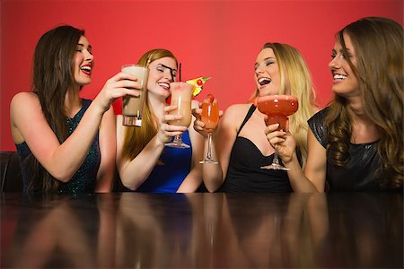simsearch:649-06844392,k - Happy friends clinking glasses and chatting in a nightclub Stock Photo - Budget Royalty-Free & Subscription, Code: 400-07137883