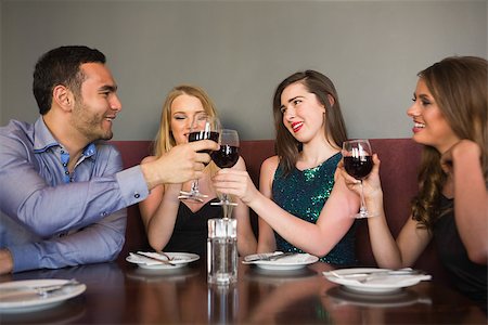 pic of friends in bar celebration - Friends clinking red wine glasses at a bar and chatting Stock Photo - Budget Royalty-Free & Subscription, Code: 400-07137937