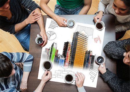 Overhead view of people sitting around table with painted city on sheet while having a cup of coffee Stock Photo - Budget Royalty-Free & Subscription, Code: 400-07138001