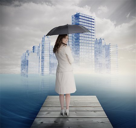 smart industry - Rear view of businesswoman holding umbrella in front of holographic city standing on bridge Stock Photo - Budget Royalty-Free & Subscription, Code: 400-07138013
