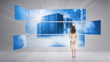 futuristic towers - Rear view of businesswoman looking at futuristic server towers in blue light Stock Photo - Budget Royalty-Free & Subscription, Code: 400-07138046