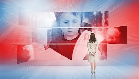 futuristic boy kid - Rear view of businesswoman looking at holographic pupil in red blue light Stock Photo - Budget Royalty-Free & Subscription, Code: 400-07138049