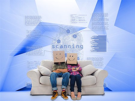 Couple with cartons on head sitting on couch under holographic finger print on blue background Stock Photo - Budget Royalty-Free & Subscription, Code: 400-07138057