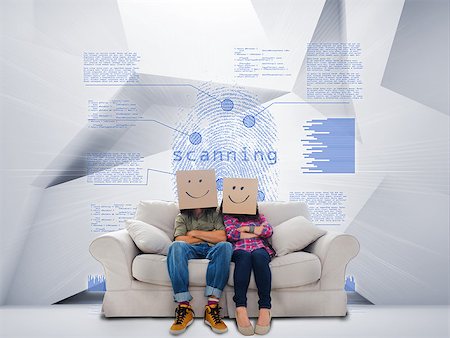 simsearch:400-07138128,k - Couple with cartons on head sitting on couch under blue holographic finger print on white background Stock Photo - Budget Royalty-Free & Subscription, Code: 400-07138059