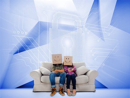simsearch:400-07138128,k - Couple with cartons on head sitting on couch under white holographic lock on blue background Stock Photo - Budget Royalty-Free & Subscription, Code: 400-07138060