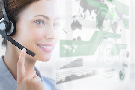 simsearch:400-07138128,k - Smiling call center employee looking at futuristic interface hologram touching her headset Stock Photo - Budget Royalty-Free & Subscription, Code: 400-07138114