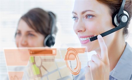 simsearch:400-07138128,k - Attractive call center employee looking at futuristic interface hologram in bright office Stock Photo - Budget Royalty-Free & Subscription, Code: 400-07138117