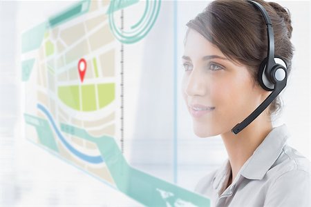 simsearch:400-07138128,k - Happy call center employee using futuristic street map interface hologram in bright office Stock Photo - Budget Royalty-Free & Subscription, Code: 400-07138111