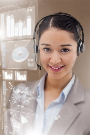 simsearch:400-07138128,k - Gorgeous cheerful businesswoman using futuristic interface hologram consulting statistics Stock Photo - Budget Royalty-Free & Subscription, Code: 400-07138130