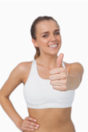 simsearch:400-07138263,k - Content pretty woman showing thumbs up smiling at camera Stock Photo - Budget Royalty-Free & Subscription, Code: 400-07138234