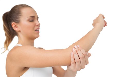 simsearch:400-07138263,k - Suffering young woman touching her sore elbow on white background Stock Photo - Budget Royalty-Free & Subscription, Code: 400-07138254