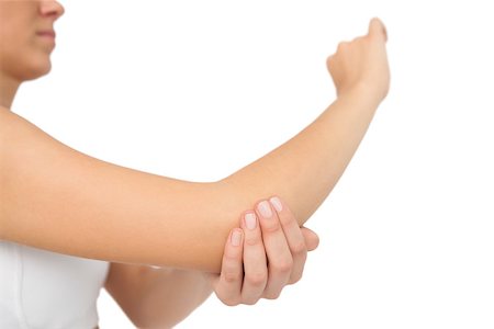 simsearch:400-06690149,k - Woman touching her sore elbow on white background Stock Photo - Budget Royalty-Free & Subscription, Code: 400-07138253