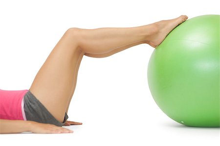 simsearch:400-07139290,k - Close up of female legs with exercise ball on white background Stock Photo - Budget Royalty-Free & Subscription, Code: 400-07139215