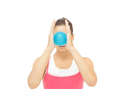 simsearch:400-07139290,k - Toned brunette holding blue massage ball between hands  on white background Stock Photo - Budget Royalty-Free & Subscription, Code: 400-07139247