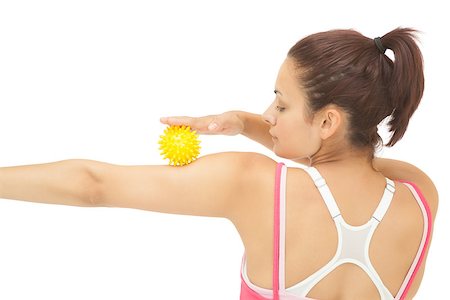 simsearch:400-07139290,k - Rear view of sporty brunette touching arm with yellow massage ball on white background Stock Photo - Budget Royalty-Free & Subscription, Code: 400-07139241