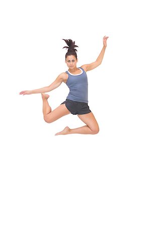 simsearch:400-07139290,k - Attractive sporty brunette jumping in the air on white background Stock Photo - Budget Royalty-Free & Subscription, Code: 400-07139286