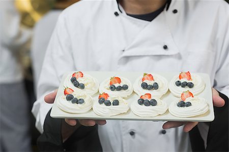 simsearch:400-07140055,k - Chef presenting plate of meringues in commercial kitchen Stock Photo - Budget Royalty-Free & Subscription, Code: 400-07139990