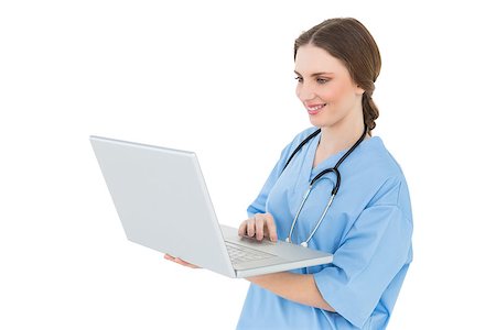 doctors working on teenager - Female doctor working with her notebook and smiling Stock Photo - Budget Royalty-Free & Subscription, Code: 400-07131168