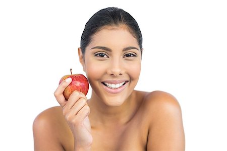 Cheerful nude brunette holding red apple on white background Stock Photo - Budget Royalty-Free & Subscription, Code: 400-07131867