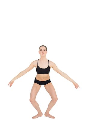 simsearch:400-07138263,k - Focused slim ballet dancer jumping in the air on white background Stock Photo - Budget Royalty-Free & Subscription, Code: 400-07132538