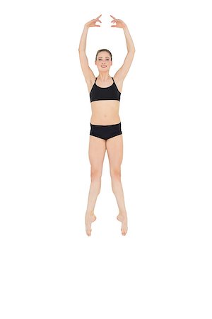 simsearch:400-07139290,k - Happy slim ballet dancer jumping in the air on white background Stock Photo - Budget Royalty-Free & Subscription, Code: 400-07132539