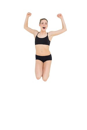 simsearch:400-07139290,k - Strong slim model jumping in the air on white background Stock Photo - Budget Royalty-Free & Subscription, Code: 400-07132531