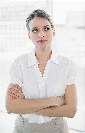 simsearch:693-03707560,k - Thoughtful businesswoman posing in her office with arms crossed Fotografie stock - Microstock e Abbonamento, Codice: 400-07133689