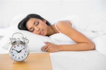 Calm beautiful woman sleeping lying in her bed in bright bedroom Stock Photo - Budget Royalty-Free & Subscription, Code: 400-07133696