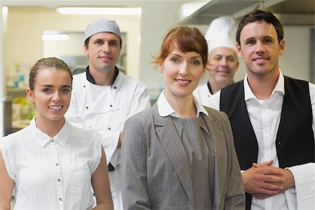 restaurant work teenager - Young female manager posing in a modern kitchen with the staff Stock Photo - Budget Royalty-Free & Subscription, Code: 400-07140039