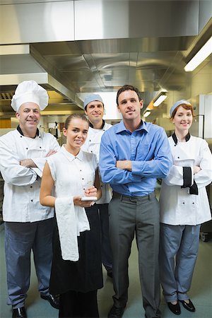 restaurant work teenager - Restaurant team posing together in a kitchen Stock Photo - Budget Royalty-Free & Subscription, Code: 400-07140032