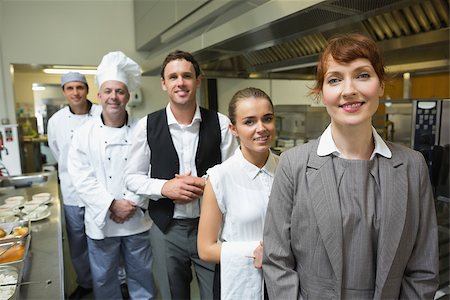 simsearch:400-07140055,k - Nice female manager posing with the staff in a professional kitchen Stock Photo - Budget Royalty-Free & Subscription, Code: 400-07140040