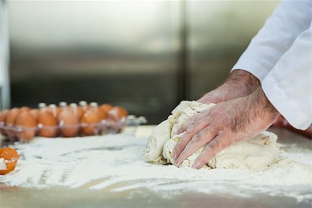 simsearch:400-07615342,k - Close up of baker preparing dough in professional kitchen Stock Photo - Budget Royalty-Free & Subscription, Code: 400-07141310